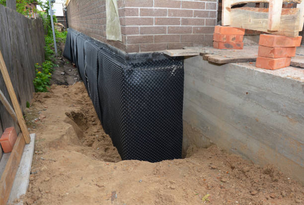 Happy homeowners after waterproofing job in North Manchester